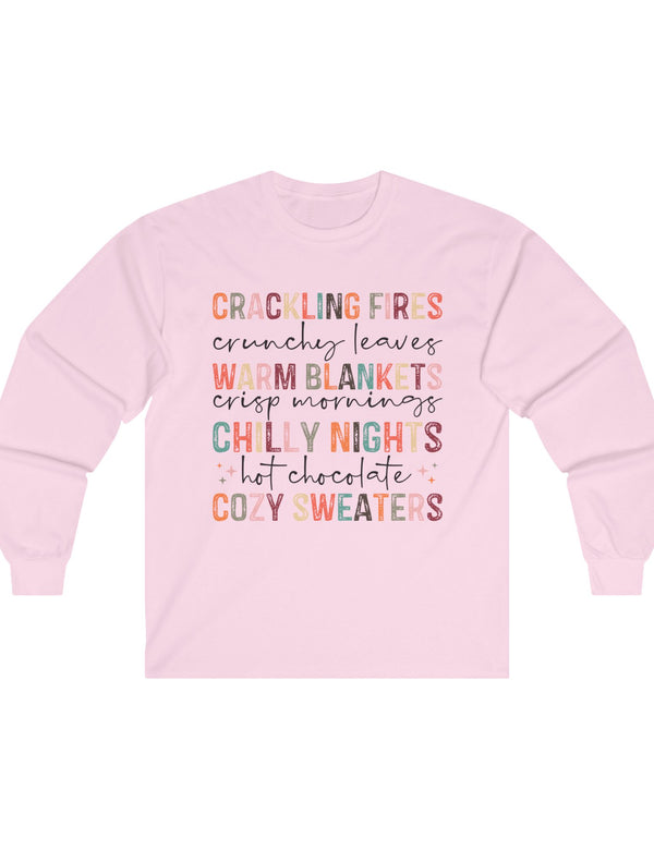 Crackling Fires, Warm Blankets, Chilly Nights, and Cozy Sweaters in this Cozy Long-Sleeve Tee!