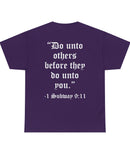"Do unto others before they do unto you." White text on back of darker colored shirt.