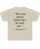 "Do unto others before they do unto you." Black text on back of shirt.