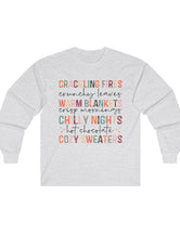 Crackling Fires, Warm Blankets, Chilly Nights, and Cozy Sweaters in this Cozy Long-Sleeve Tee!